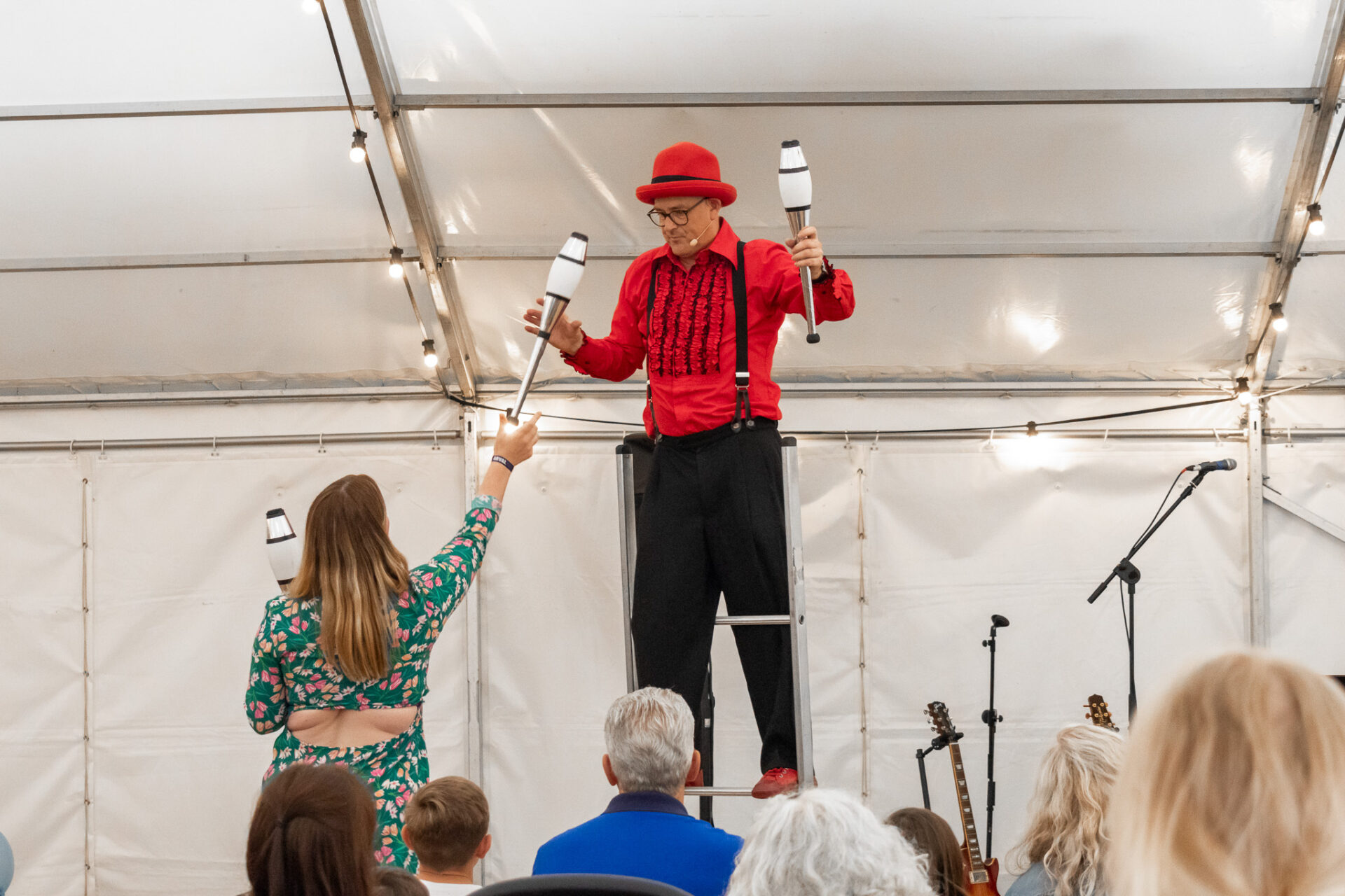 Arvalfest family fun day stilt walker / magician secured by the entertainment coordination team